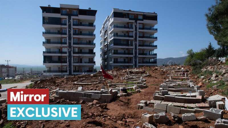 Newly dug graves by damaged apartment blocks in Nurdağı, west of Gaziantep (Image: Andy Stenning/Daily Mirror)