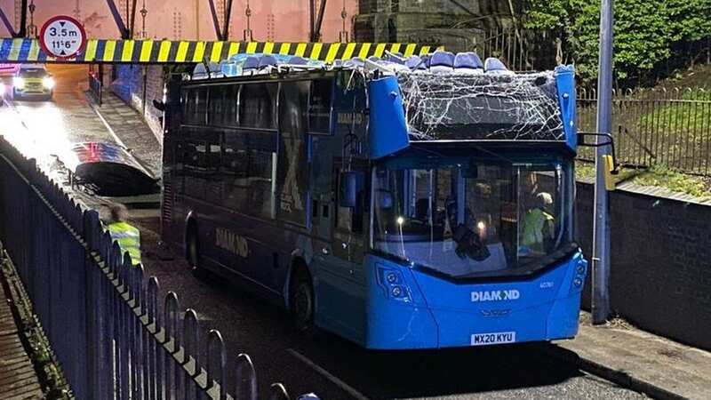 The bus was left in two separate pieces after the collision, which saw a major police operation to seal the road (Image: Manchester Evening News)