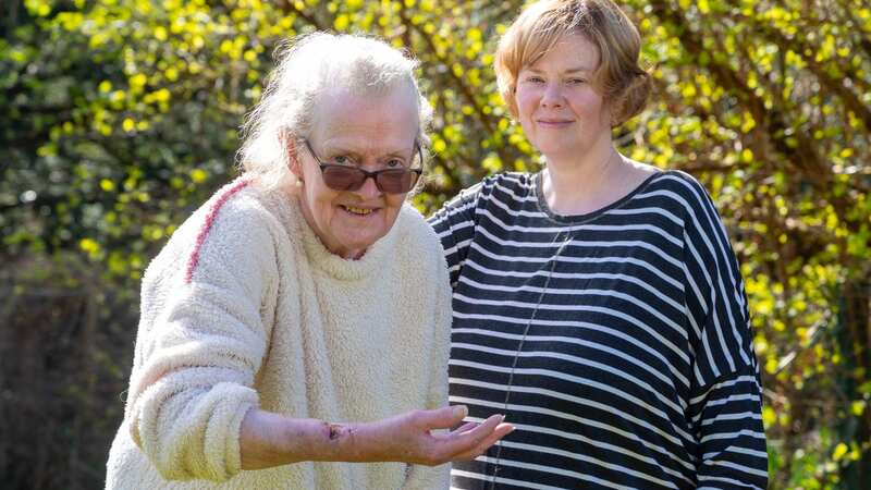 Gaby Beaumont, pictured with daughter Alison, spent four nights in hospital after she was attacked by a feral cat in her garden (Image: Perthshire Advertiser)