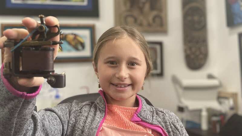 Scarlett, nine, is proud of herself for her designs (Image: Christine Fleming / SWNS)