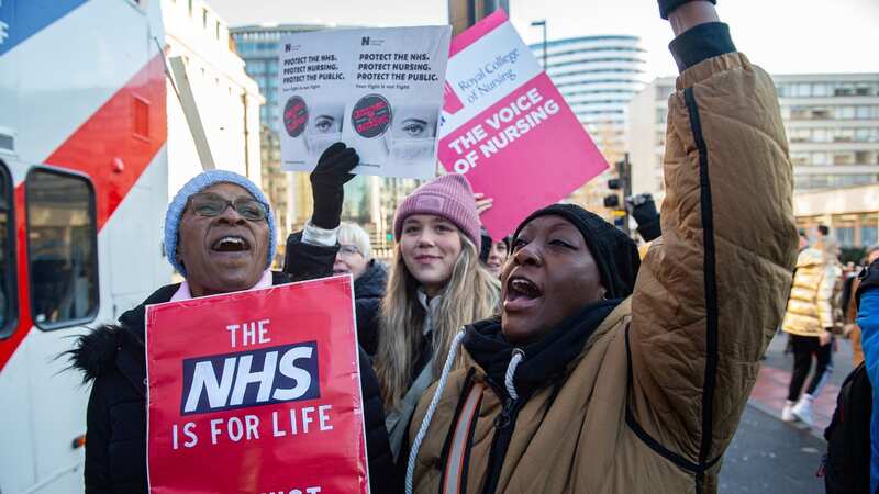 Striking nurses attend their picket line at St Thomas