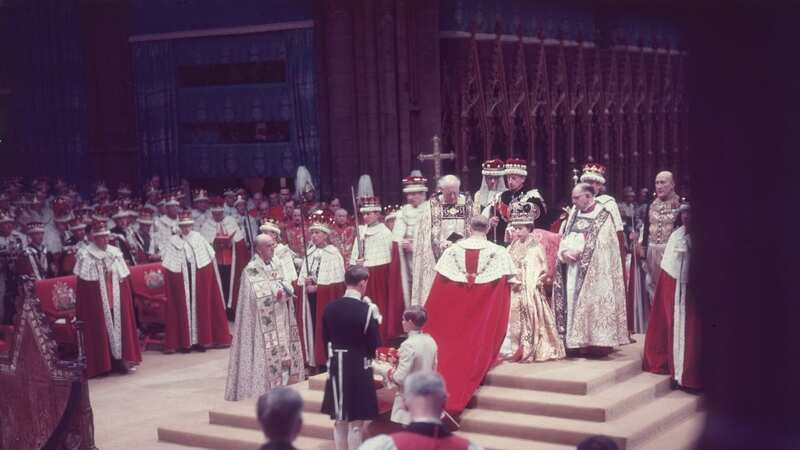 The Duke of Edinburgh pays homage to his wife, the newly crowned Queen Elizabeth II, during her coronation ceremony in 1953 (Image: Getty Images)