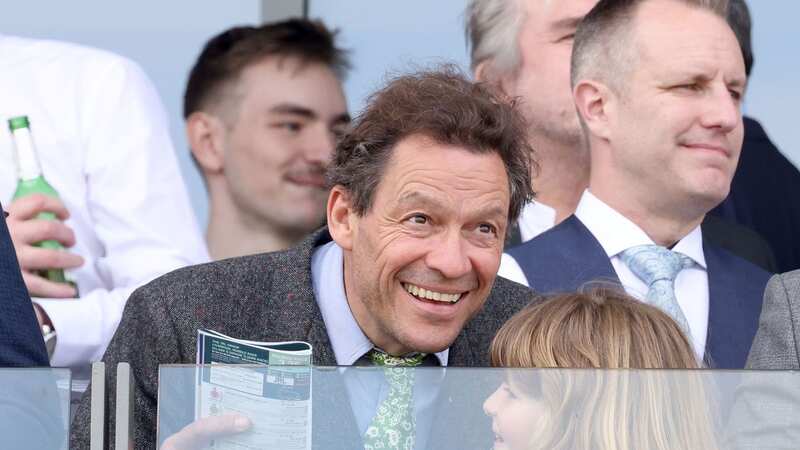 Dominic West watches the racing at Aintree (Image: Julian Hamilton/Sunday Mirror)