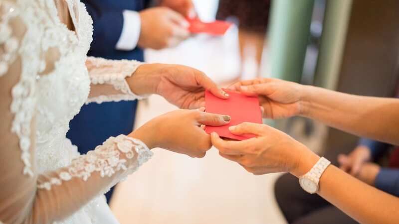 The bride and groom want money instead of gifts (stock photo) (Image: Getty Images/iStockphoto)
