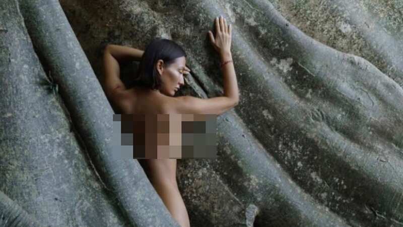 Luiza Kosykh posed naked on a 700-year-old sacred tree in Tabanan, Bali (Image: Newsflash)