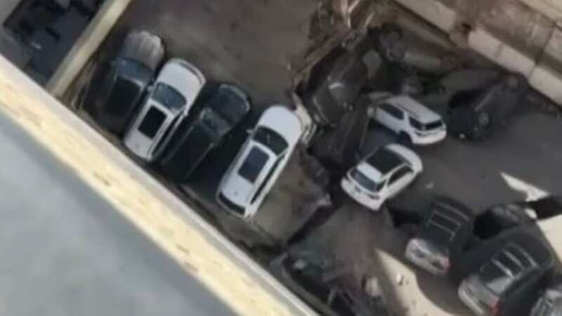 One dead and five injured after parking garage collapses on top of cars
