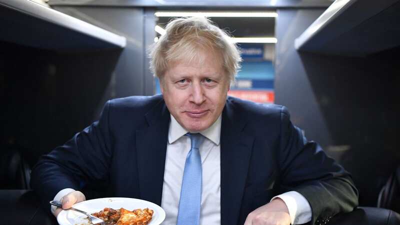 Boris Johnson was criticised after scrapping a proposed ban on buy-one-get-one-free deals for unhealthy food products (Image: AFP via Getty Images)