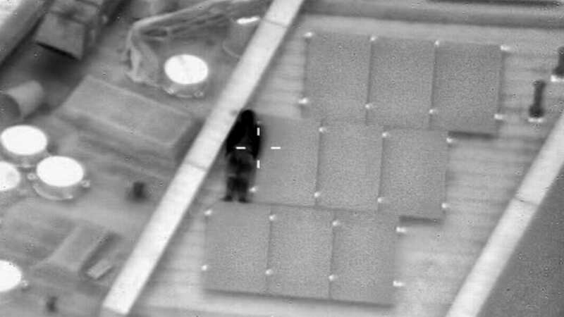 The trickster appeared to be laying against a solar panel on the roof of a building in Wandsworth, London, but they were spotted by police circling above in a helicopter (Image: @NPASLondon/Twitter)