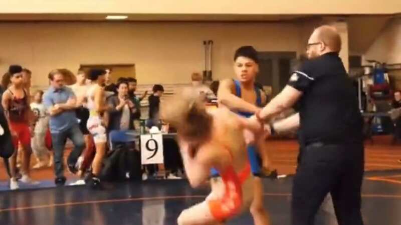 The sucker punch occurred following the end of a wrestling youth match in Illinois (Image: Twitter@https://twitter.com/TalenGuzman/status/1648372319469858816)