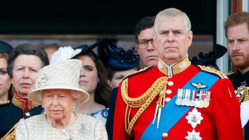 Elizabeth II and Prince Andrew watch a flypast from the Buckingham Palace balcony in 2019 (Image: Getty Images)