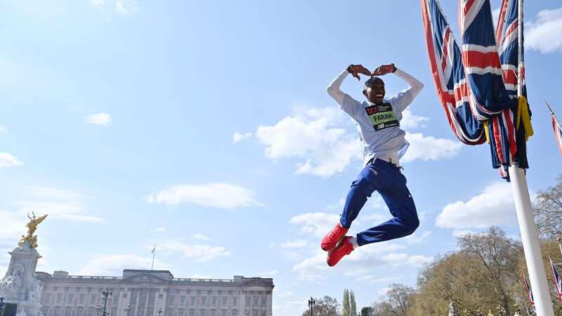An airborne Farah performs his trademark Mobot pose outside Buckingham Palace (Image: AFP via Getty Images)