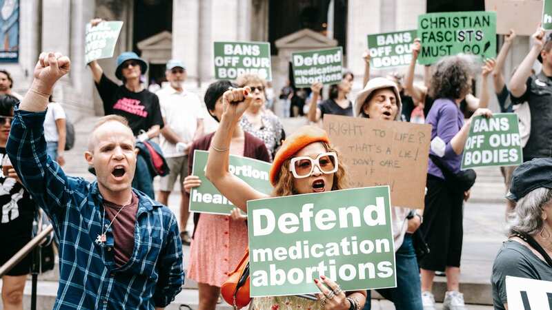 Pro-abortion rights activists with signs that read "Defend Medication Abortions" (Image: Olga Fedorova/SOPA Images/REX/Shutterstock)