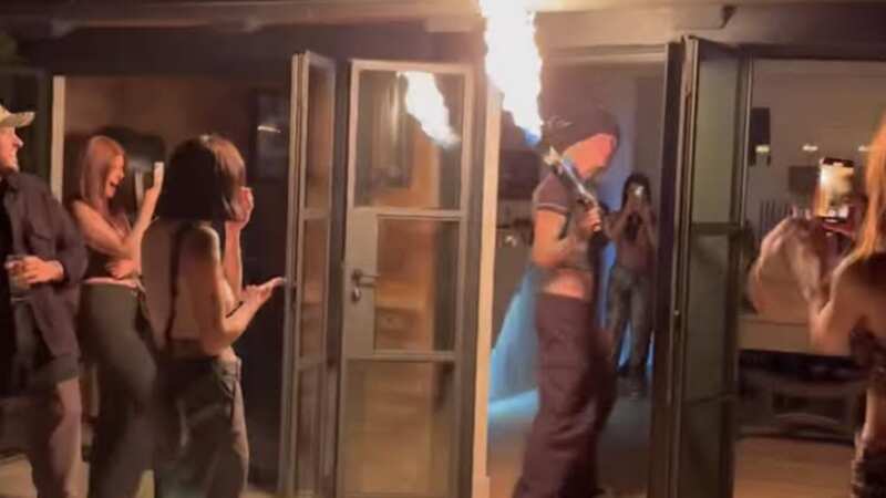 Machine Gun Kelly wields flamethrower at 