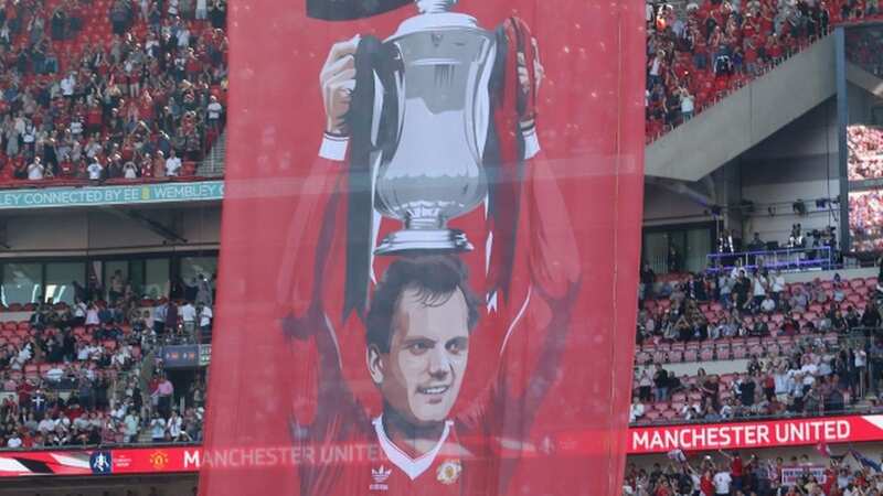 Ray Wilkins with his wife Jackie and their son Ross posing for a special family photograph with the FA Cup in 1983