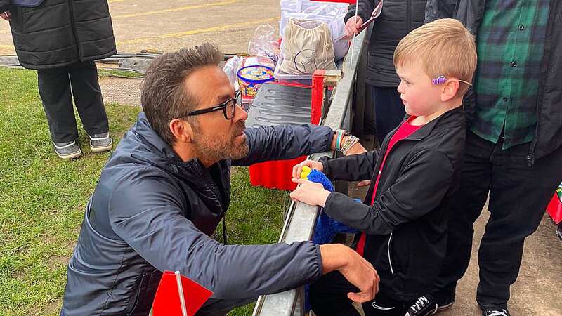 Moment Ryan Reynolds seeks out poorly Wrexham fan, 9, before promotion clash