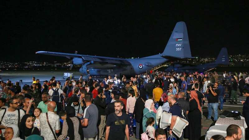 People evacuated from Sudan arrive at a military airport in Amman (Image: AFP via Getty Images)
