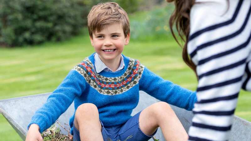 A smiling photo of Prince Louis in a wheelbarrow released for his 5th birthday (Image: Kensington Palace)