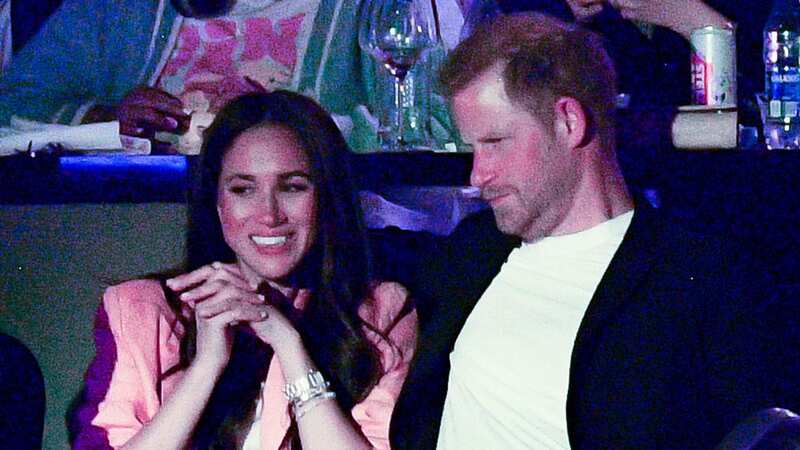Meghan and Harry at an LA Lakers basketball match last night (Image: Getty Images)