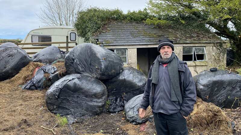 Neil Parker has been blocked in with bales of rotting silage (Image: Cambrian News / SWNS)
