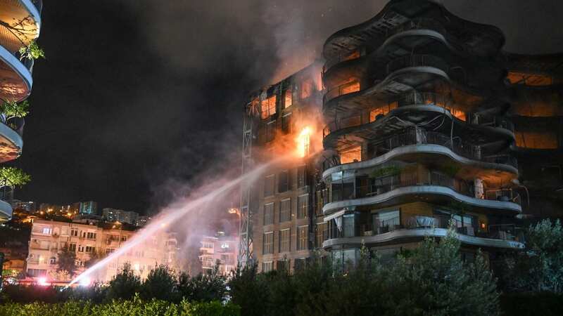 Residents could be seen jumping for their lives from balconies after the fire started (Image: Anadolu Agency via Getty Images)