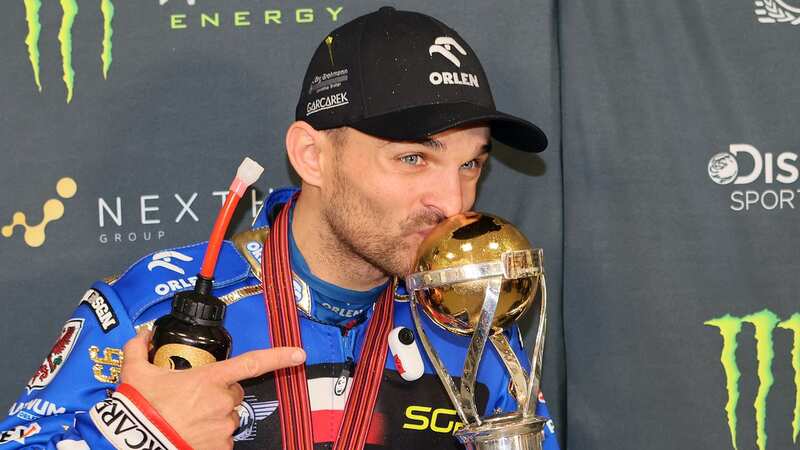Zmarzlik holds the World Championship trophy that all 15 riders want to win (Image: FIMSpeedway.com)