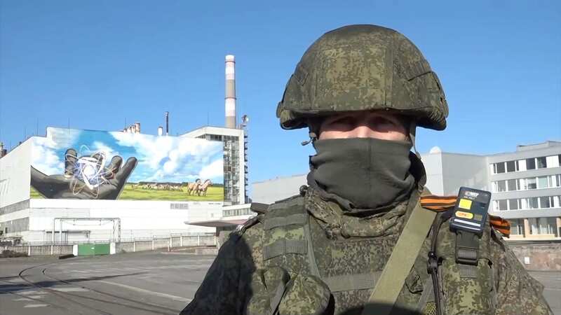 A Russian soldier stands outside the Chernobyl nuclear plant (Image: EPN/Newscom / Avalon)