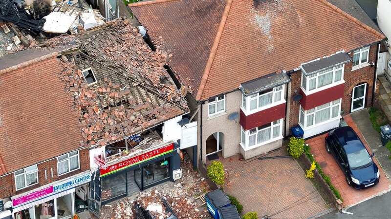 Emergency services scrambled to the scene after the top floor blasted off in the explosion (Image: UKNIP)