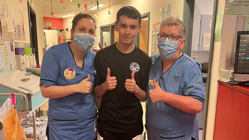 Connor Elliot poses with staff at Royal Hospital for Children in Glasgow