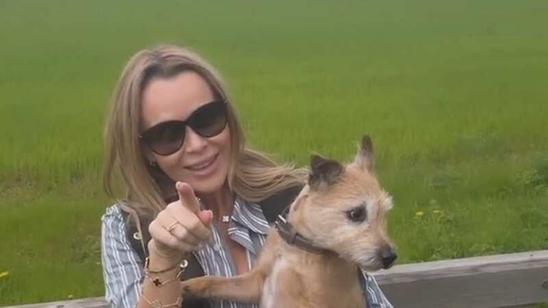 Amanda Holden enjoys romantic walk with rarely-seen husband in the countryside