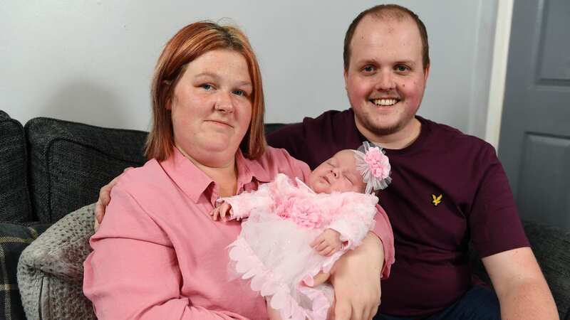 Rhiannon Lucas and Adam Saunders pose with their baby Summer-Gracie (Image: WALES NEWS SERVICE)
