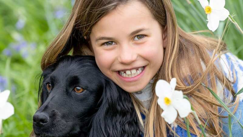 Princess Charlotte on her 8th birthday hugging dog Orla (Image: Millie Pilkington/Kensington Palace)