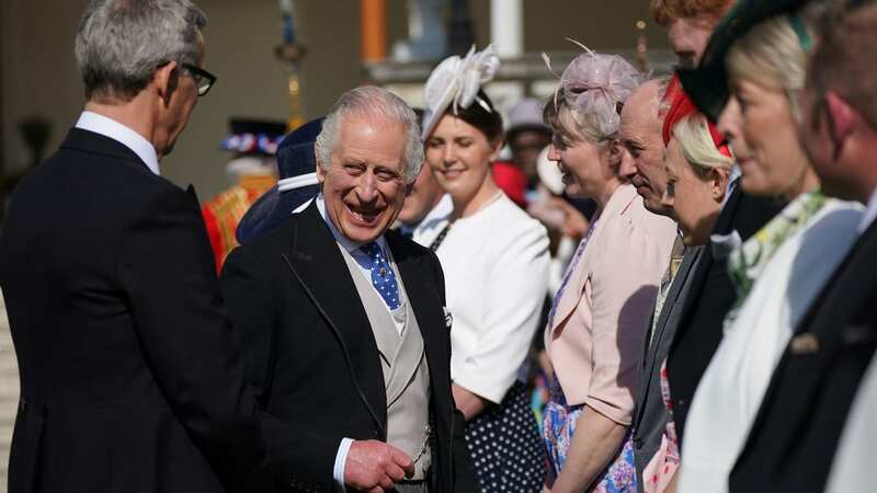 King laughs and smiles at garden party as he mingles with 8,000-strong crowd