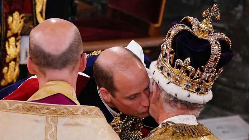 Prince William kissing his father on the cheek (Image: POOL/AFP via Getty Images)