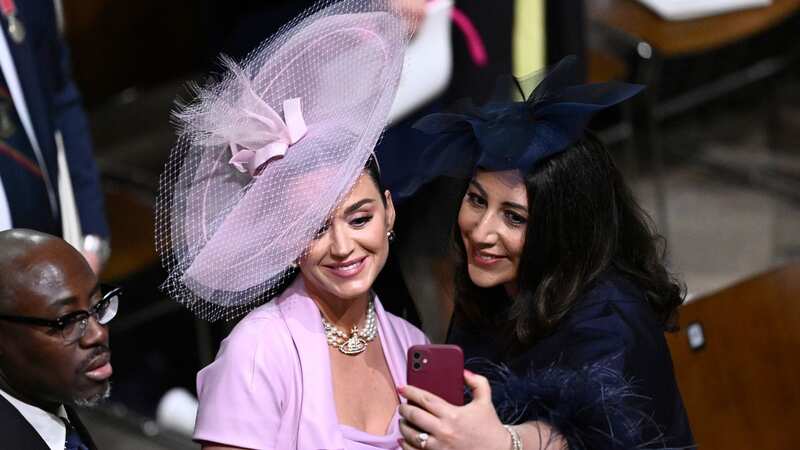Edward Enninful, Katy Perry and Nadia El-Nakla take a selfie during the Coronation of King Charles III and Queen Camilla (Image: Gareth Cattermole/Getty Images)