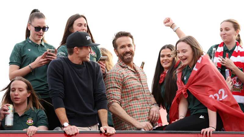 Ryan Reynolds and Rob McElhenney celebrate on an open bus parade in Wrexham (Image: Jan Kruger/Getty)