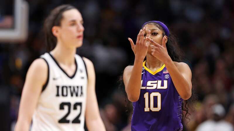 Angel Reese taunted Caitlin Clark by pointing to her ring finger before the final buzzer went (Image: Getty)