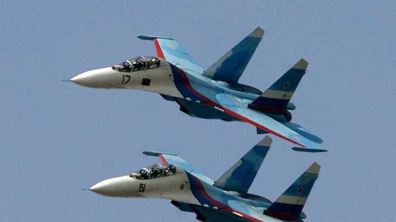 Two Sukhoi SU-27 jet fighters of the Russian Knights aerobatic team (Image: Getty Images)