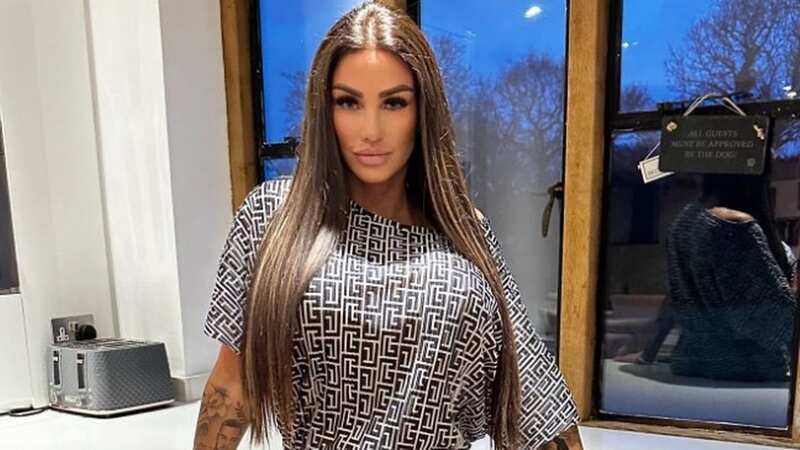 Katie Price all smiles with Benidorm icon during getaway with Carl Woods
