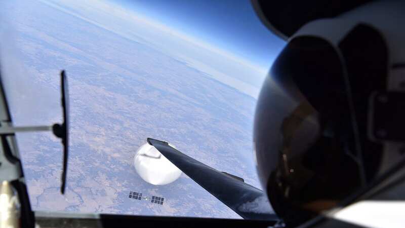 A US Air Force pilot looks down at a suspected Chinese surveillance balloon as it hovers over the Central Continental United States on February 3 (Image: © US DoD/SWNS)