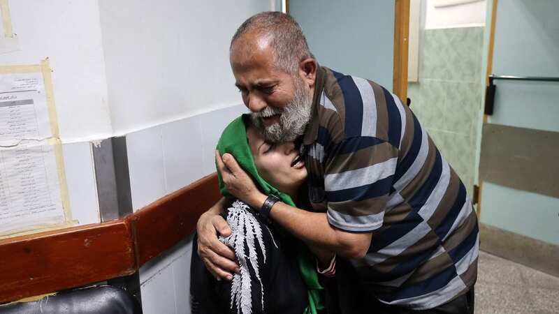 Relatives of Palestinian Islamic Jihad leader Jihad Ghannam, who was killed by an Israeli airstrike at his home, mourn at Alnajjar hospital (Image: AFP via Getty Images)
