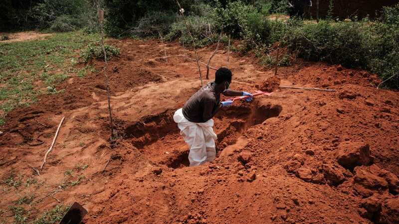 Police continue to exhume the bodies of members of a starvation cult buried in an east Kenyan forest (Image: Uncredited/AP/REX/Shutterstock)