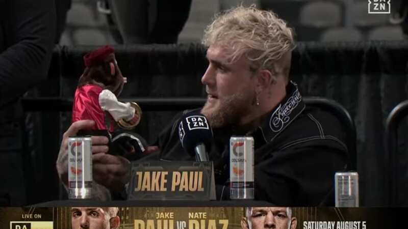Jake Paul mocks rival Nate Diaz by facing off with clapping toy monkey
