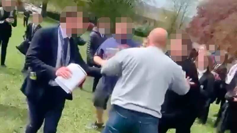 Dads brawl in field in front of screaming schoolkids in fight 