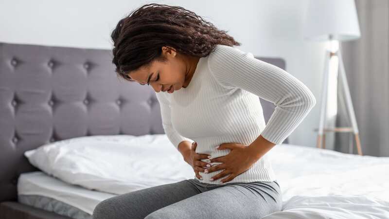 Lower abdominal pain is a common symptom of bowel cancer (Image: Getty Images/iStockphoto)