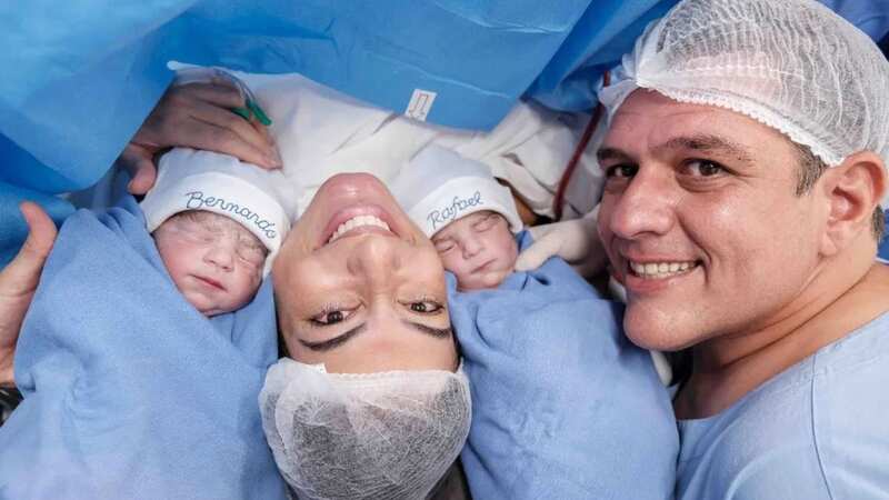 Jaqueline Melo Oliveira and husband Darlan Ribeiro are pictured with their twin babies (Image: Newsflash)