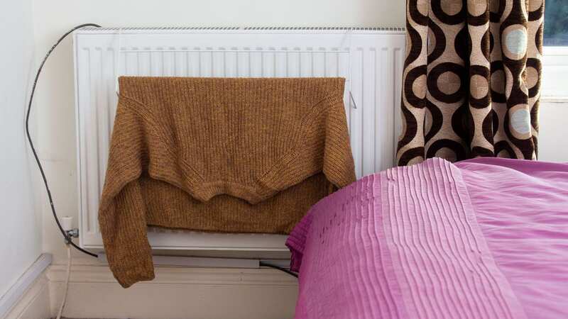 The third most-watched energy-saving hack on TikTok is to place a clothes airer near a radiator to help items dry quicker (Image: SWNS)