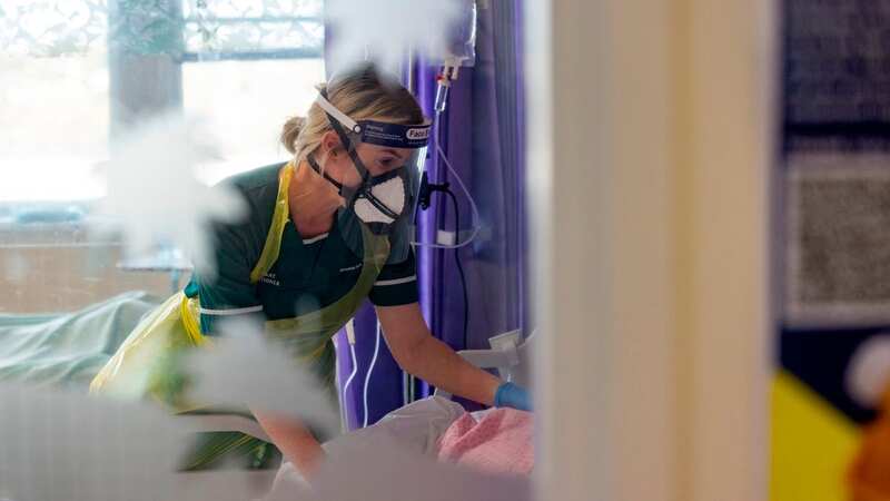 A nurse treats a Covid patient (Image: James Maloney/Lancs Live)