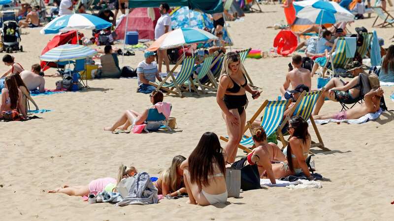 People enjoy the hot sunny weather at Bournemouth Beach (Image: REX/Shutterstock)