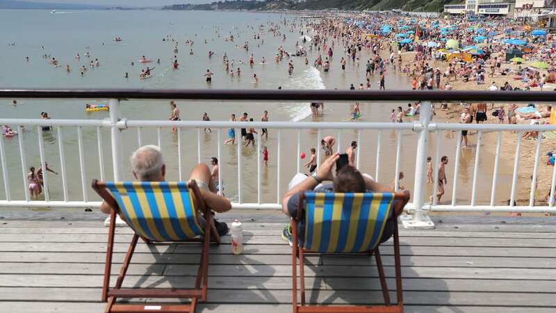 People soaking up the sun on Bournemouth Beach, Dorset (Image: PA)
