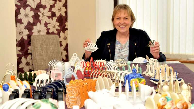 Judy with her collection of toast racks (Image: Swindon Advertiser / SWNS)